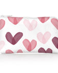 Mini white zipper cosmetic bag with multicolored pink hearts on white background