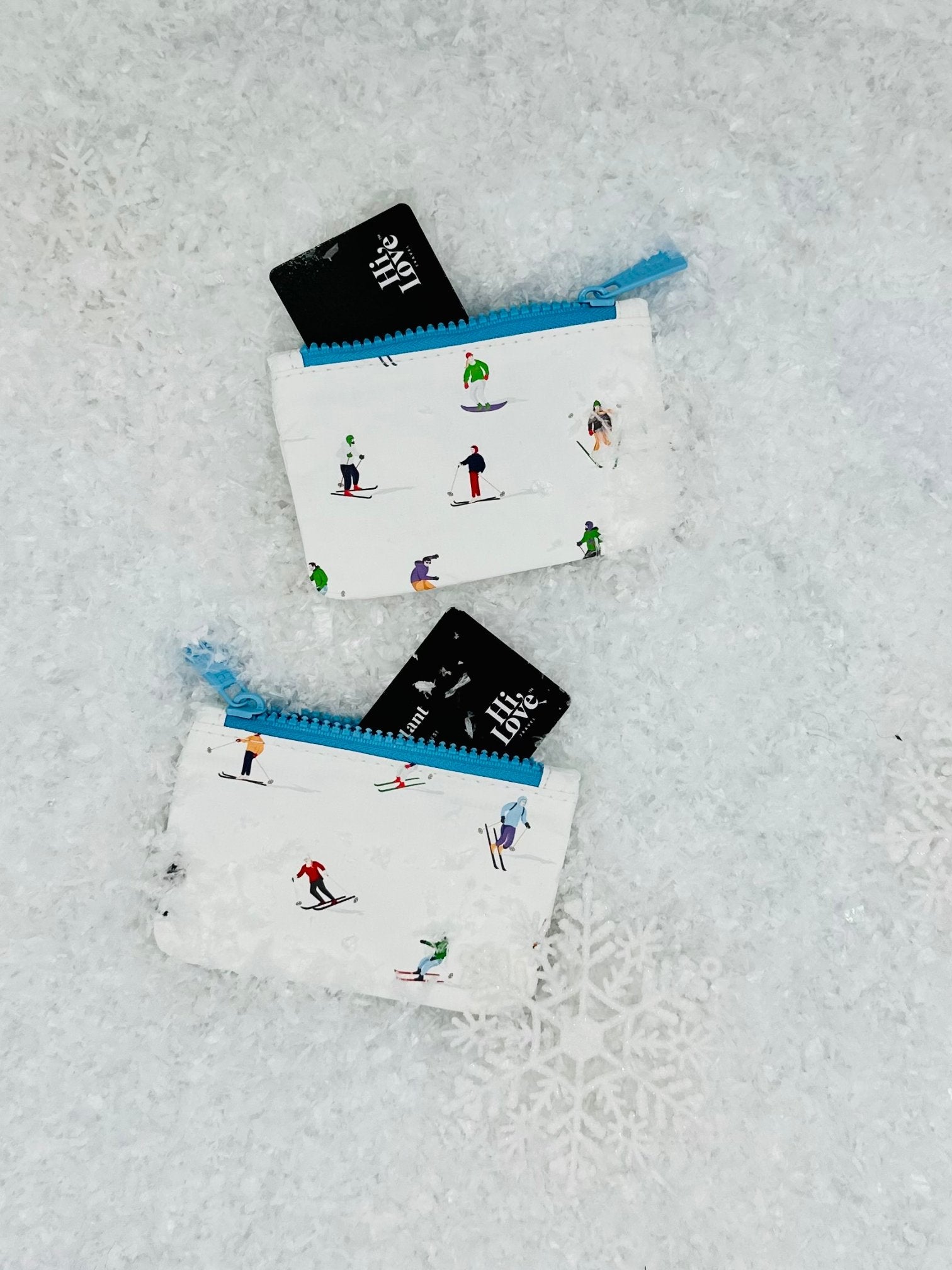 skier pattern on mini zipper pouch, set of two