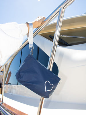 on the boat with navy wristlet with rope heart