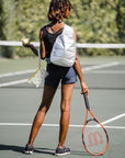 tennis pattern mini wristlet on the courts