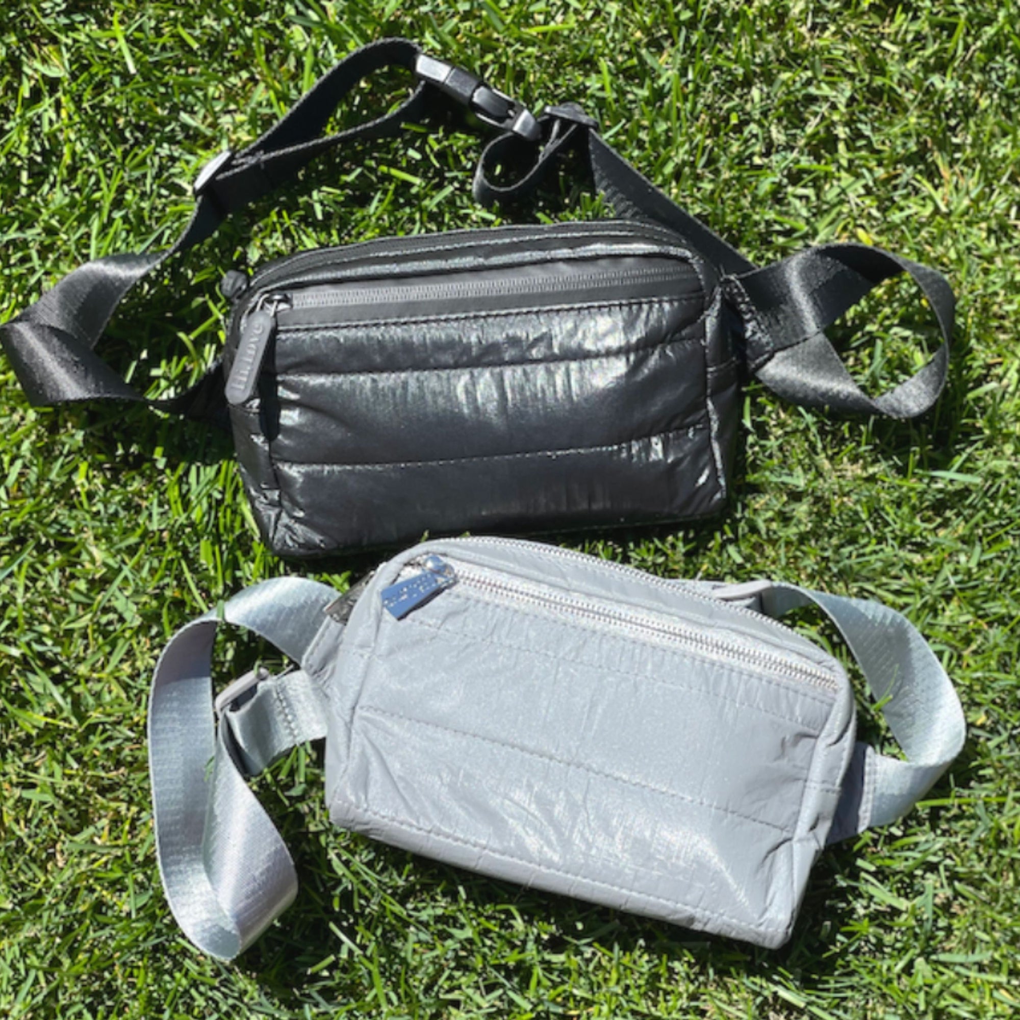 Puffer Crossbody Fanny Pack Belt Bag in Shimmer Gray and Shimmer Black on gross Background