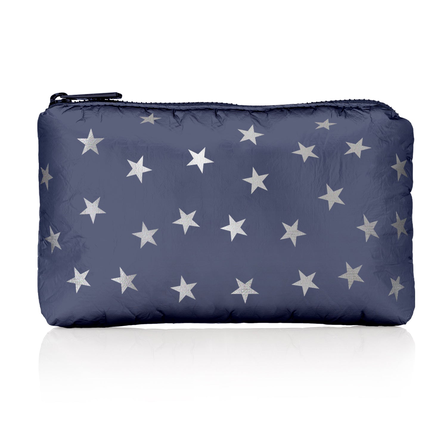 A navy blue travel pouch with a star pattern and a zipper on white background