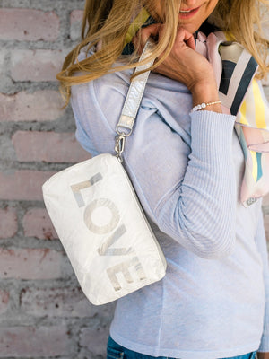 Versatile mini zipper pack in shimmer white with silver "LOVE"