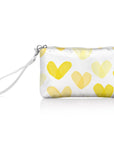 A wristlet wallet with a white background featuring a sunshine yellow heart print.