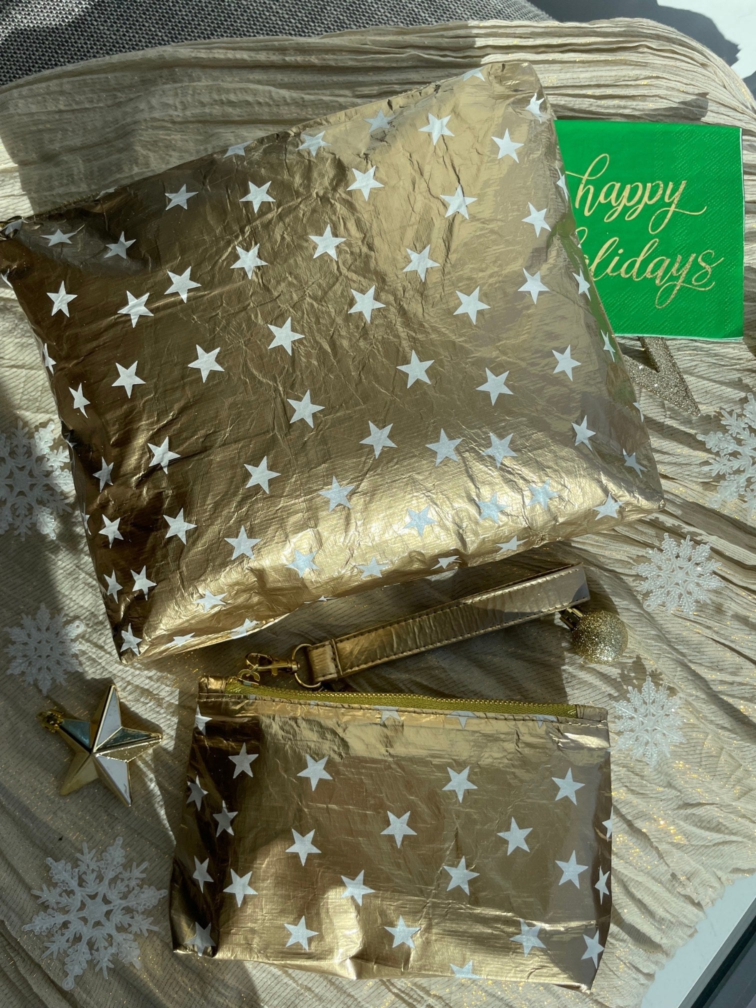 Zipper pouch in gold with white stars, great for holiday gifts